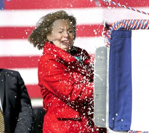 Susan Ford Bales connects with the bow of the USS Gerald R. Ford as she christens it today.