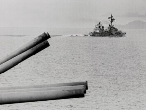 The eight-inch guns of the USS Newport News and a destroyer prepare to attack Thanh Hoa Harbor in N. Vietnam.