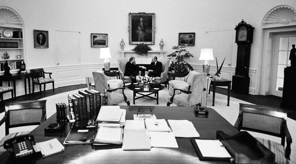 1976. Pres. Ford congratulates Pres-elect Carter in the Oval Office (DHK Photo)