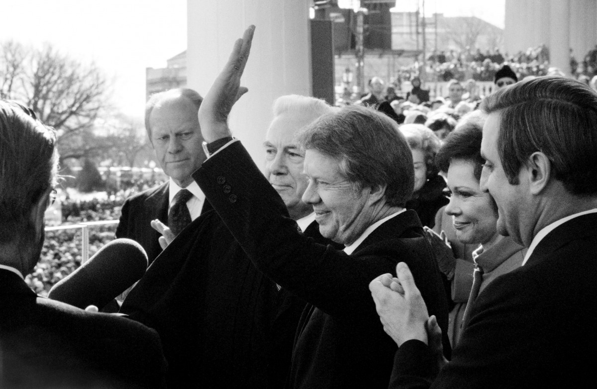 1977. Pres Jimmy Carter waves to crowd after being inaugurated as Ford watches(DHK Photo)