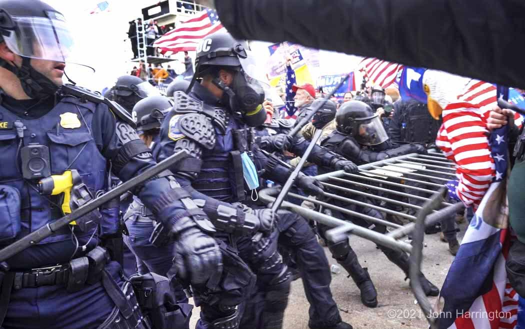 2021. Capitol police fight with rioters at US Capitol. Photo by John Harringtonith Law Enforcement