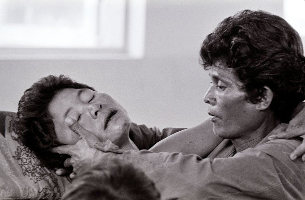PHNOM PENH -- MAR 31: A wounded Cambodian woman is comforted by her husband in a hospital, and later died in Phnom Penh, Cambodia, March 31, 1975. Phnom Penh was under attack by the Khmer Rouge, who took over the Cambodain capital less than three weeks later. (photo David Hume Kennerly/GettyImages)