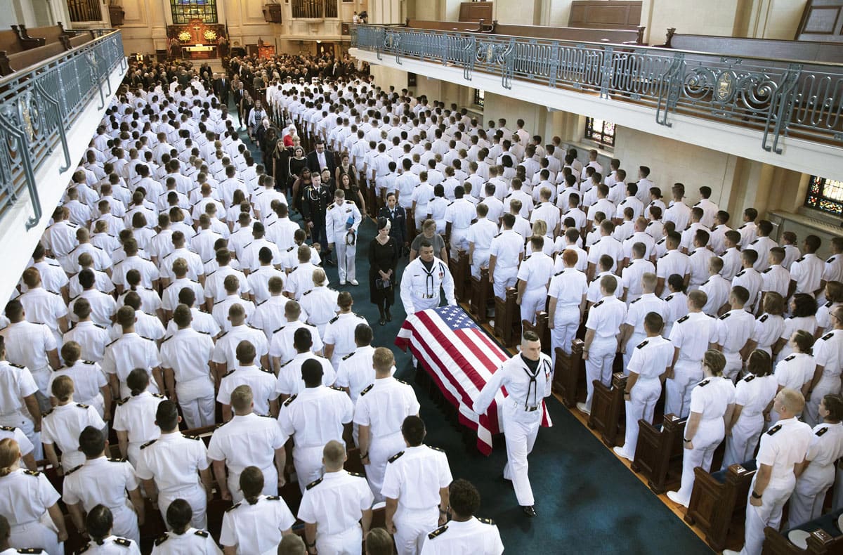 ANNAPOLIS -- SEPT 2: Sen. John McCain's casket, followed by his family, leaves the chapel at the U.S. Naval Academy, Annapolis, Maryland,   September 2, 20018,  (Photos by David Hume Kennerly/McCainFamily)