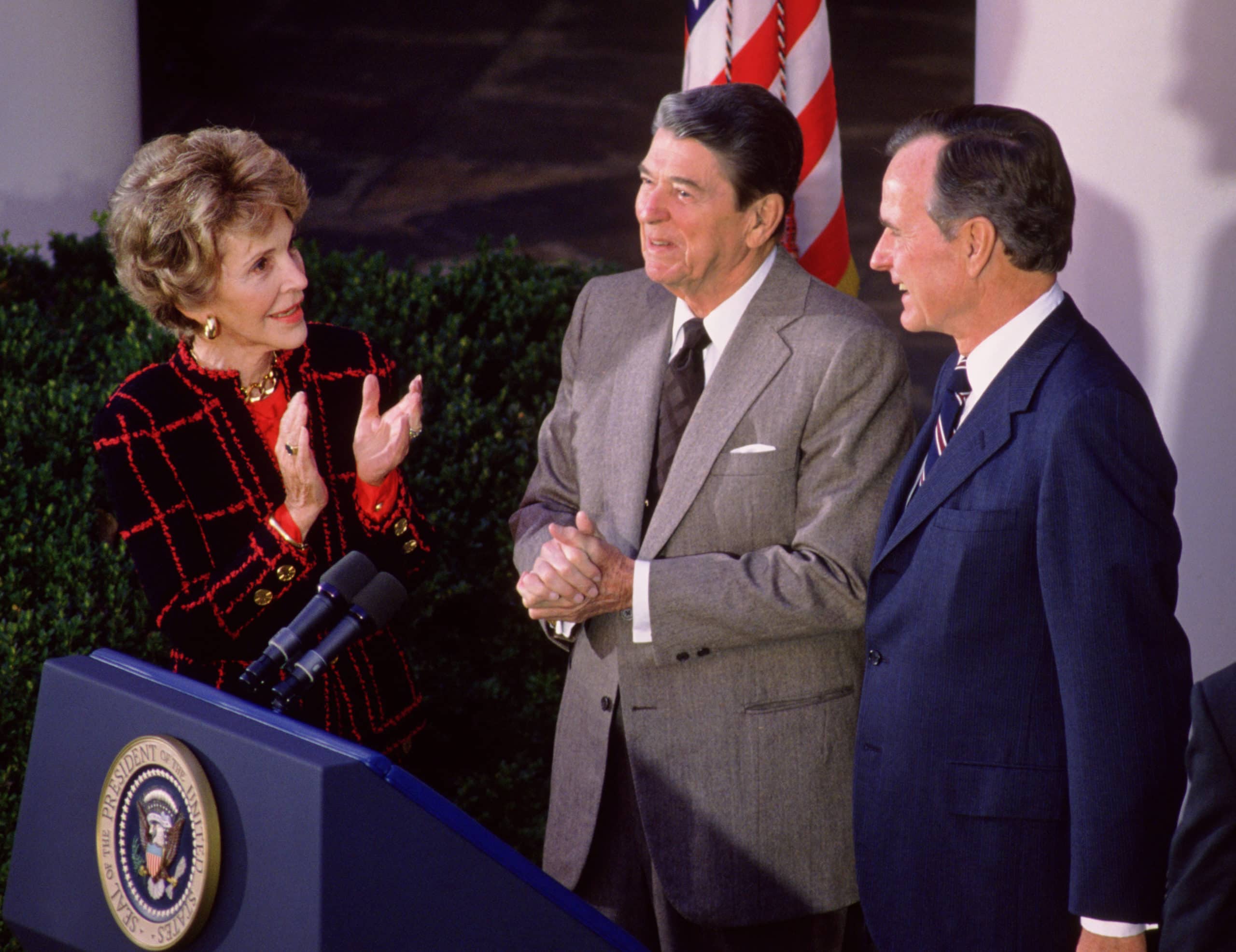 First Lady Nancy Reagan and President Ronald Reagan congratulate President-elect George Bush in the Rose Garden at the White House after Bush won the 1988 presidential election, November, 9, 1988, Washington, D.C.