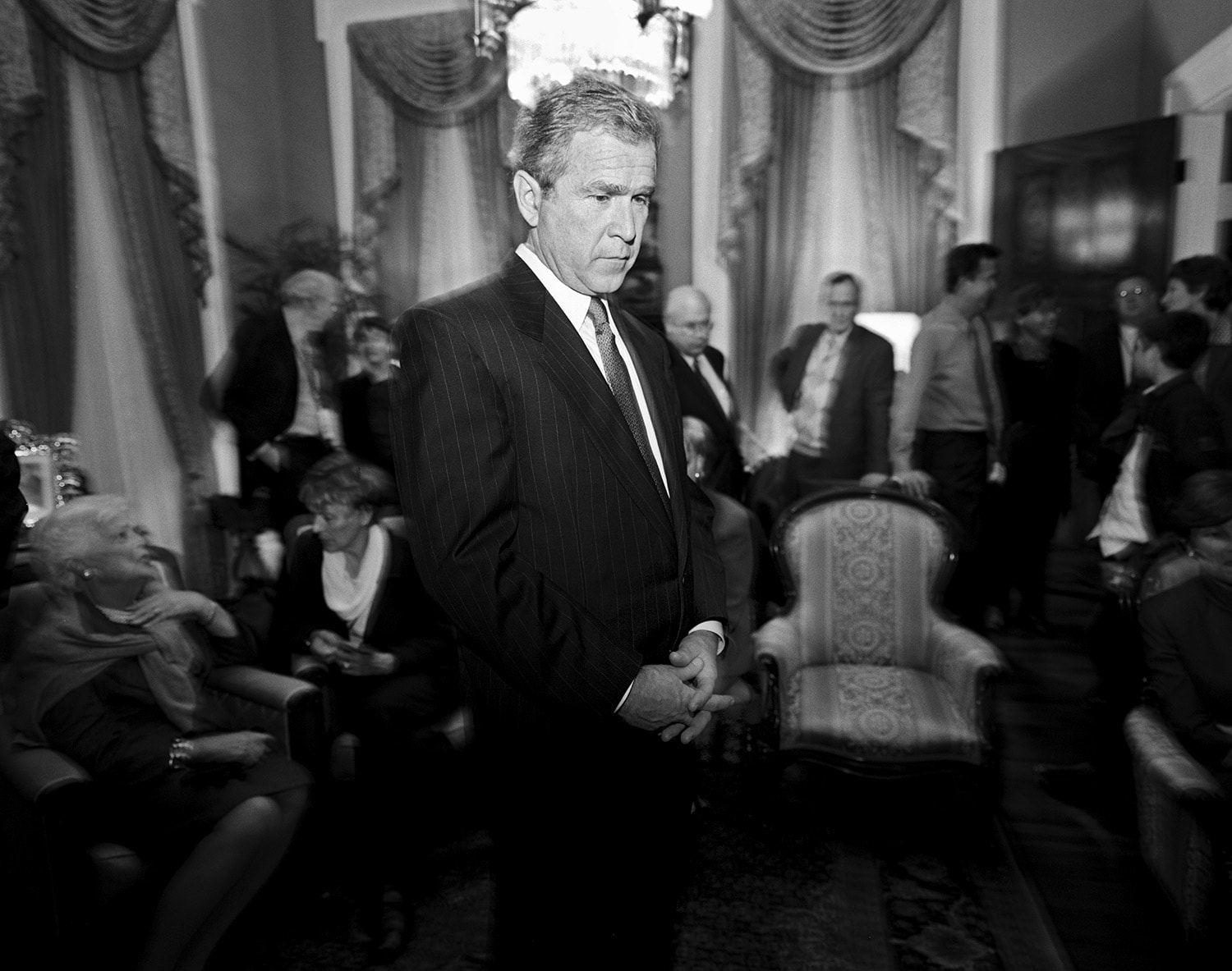 Republican presidential candidate George W. Bush watches the television right after his opponent Vice President Al Gore took back his concession in the wee hours of the next day after the election, Austin, Texas, November 7, 2000. The U.S. Supreme Court ultimately ruled that Bush won.
