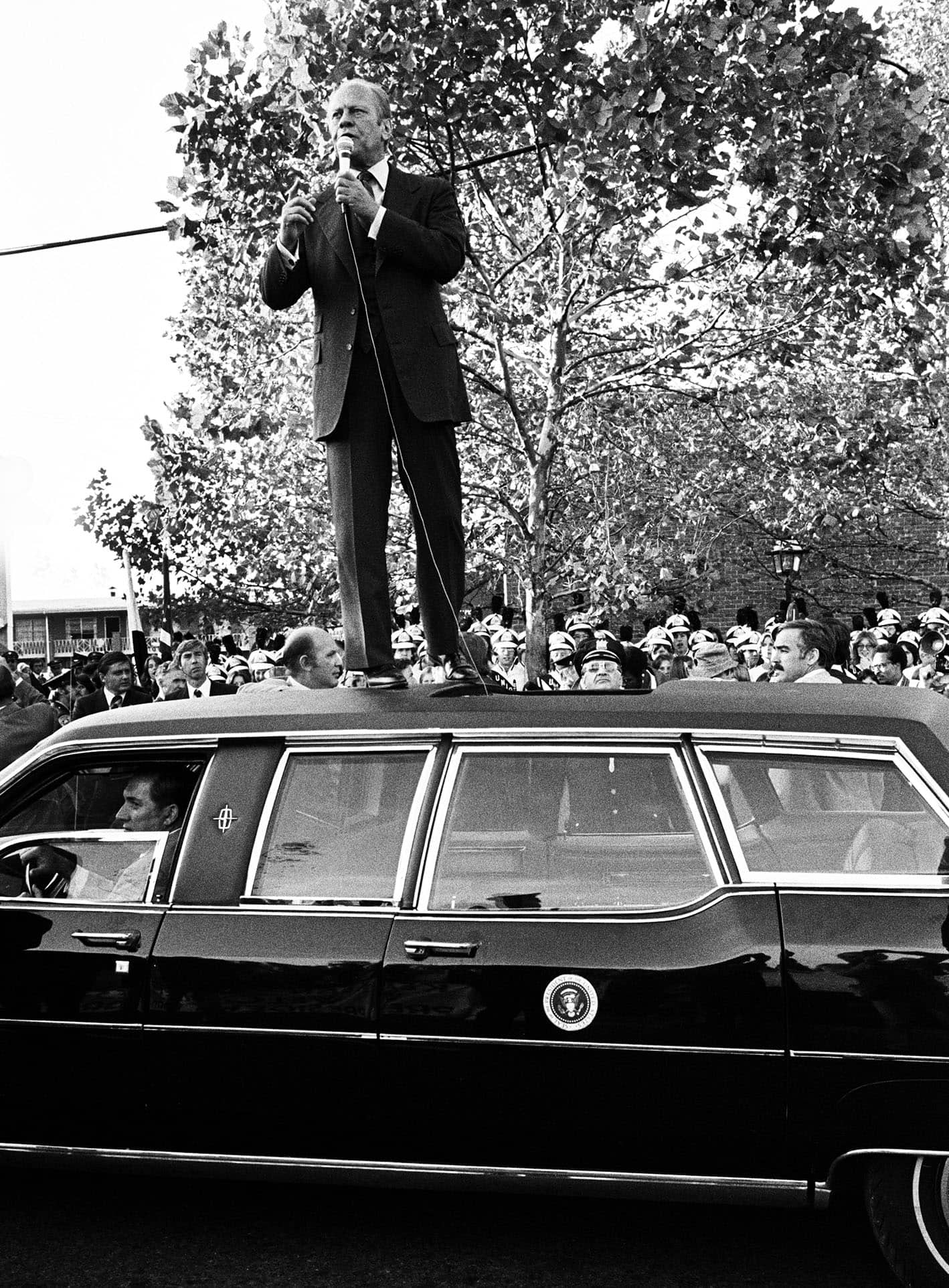 President Gerald R. Ford, another politician who liked to be above it all, atop the presidential limo campaigns during the 1976 election.