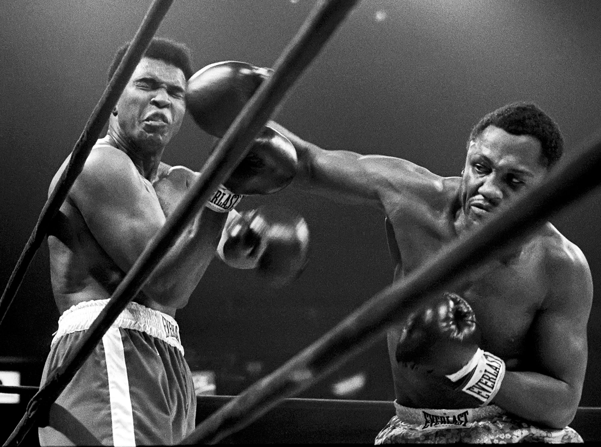 NEW YORK -- MARCH 8: Muhummad Ali takes a hit from Joe Frazier during their heavyweight match in Madison Square Garden, March 8, 1971, (photo by David Hume Kennerly)