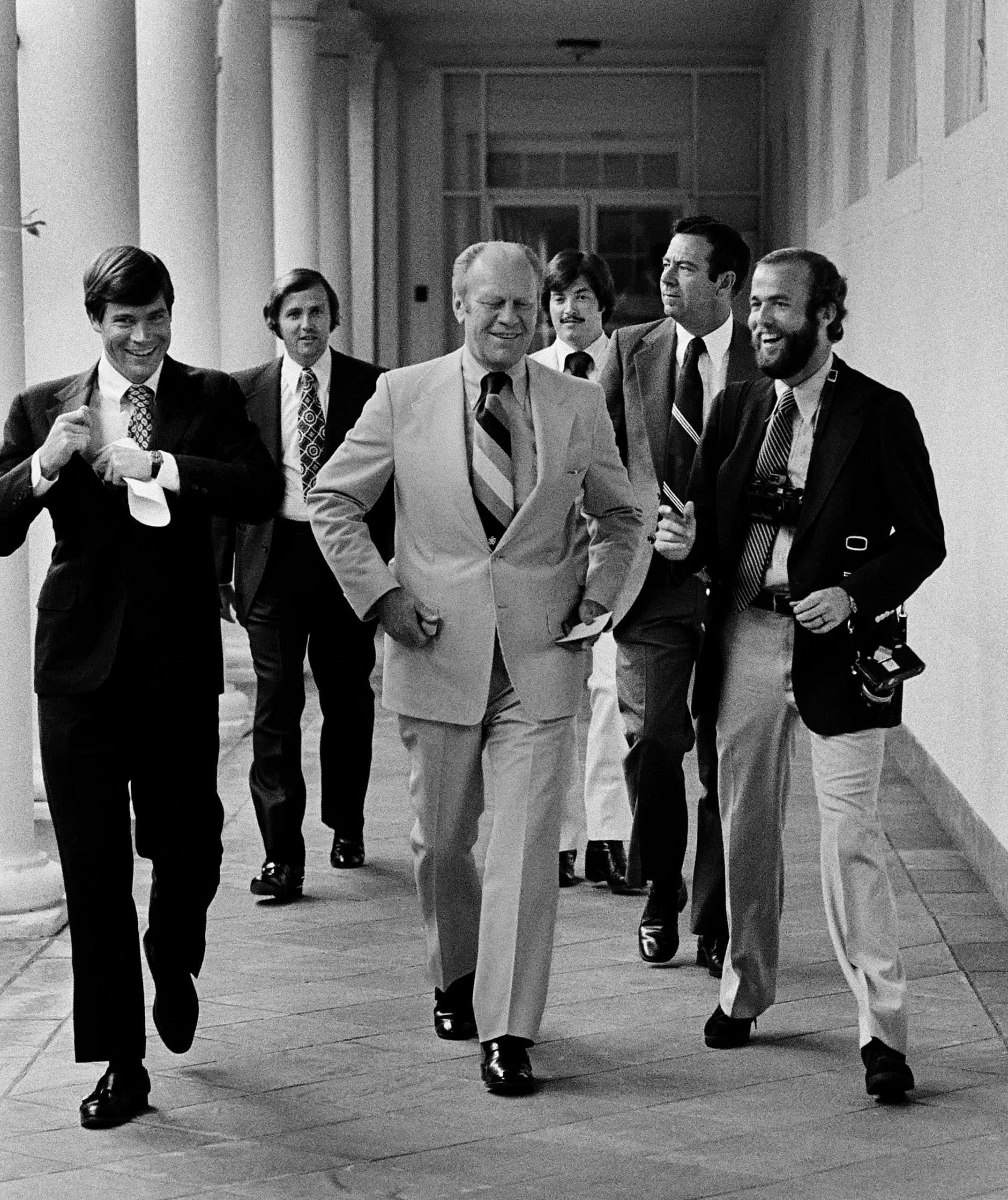 Kennerly and President Ford walk along the White House Colonnade, 1975