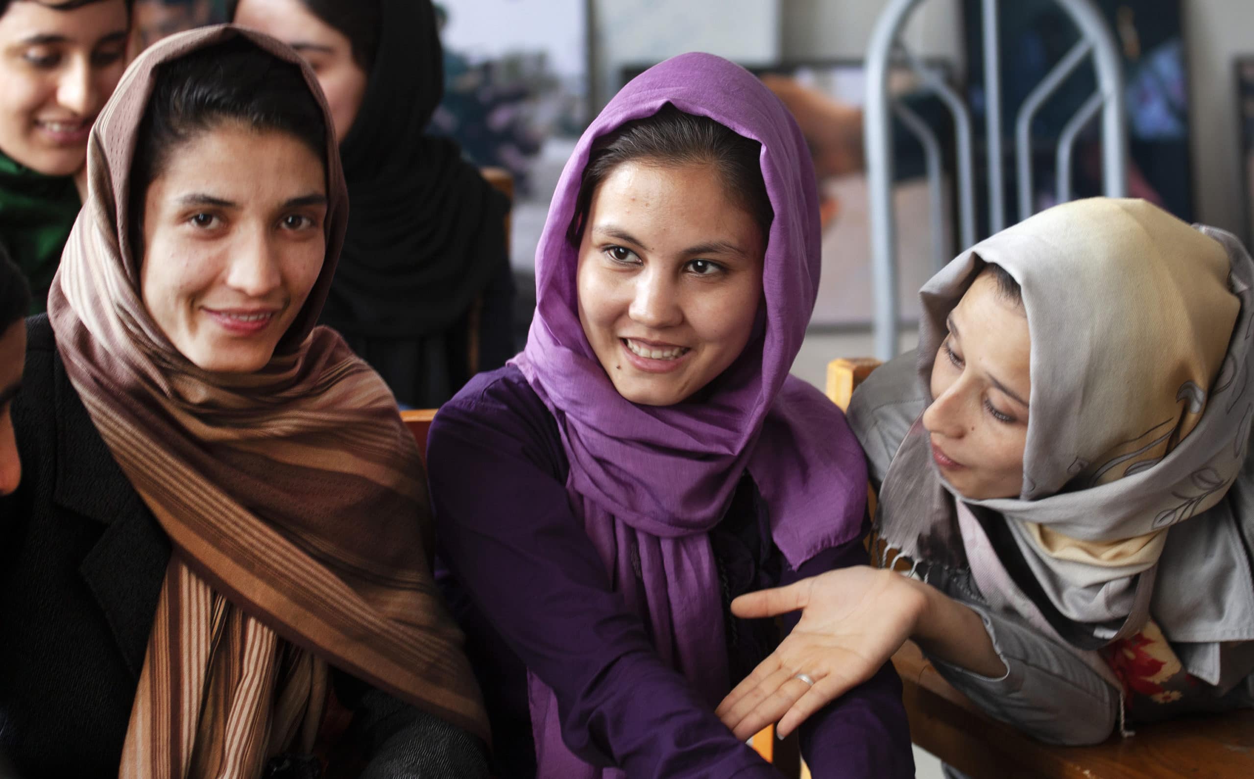 Women students attend a university class in Afghanistan
