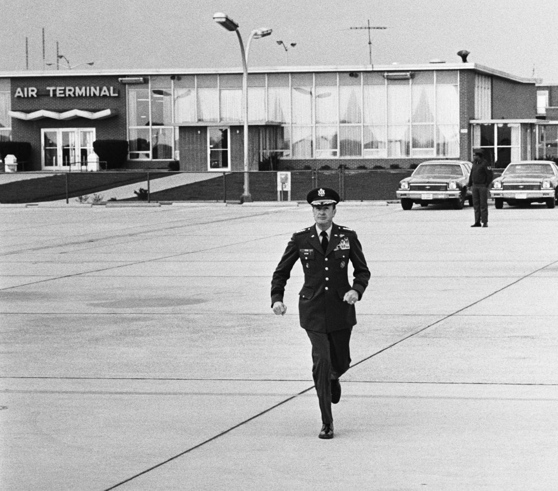 General Weyand runs to his waiting C-141 at Andrews AFB
