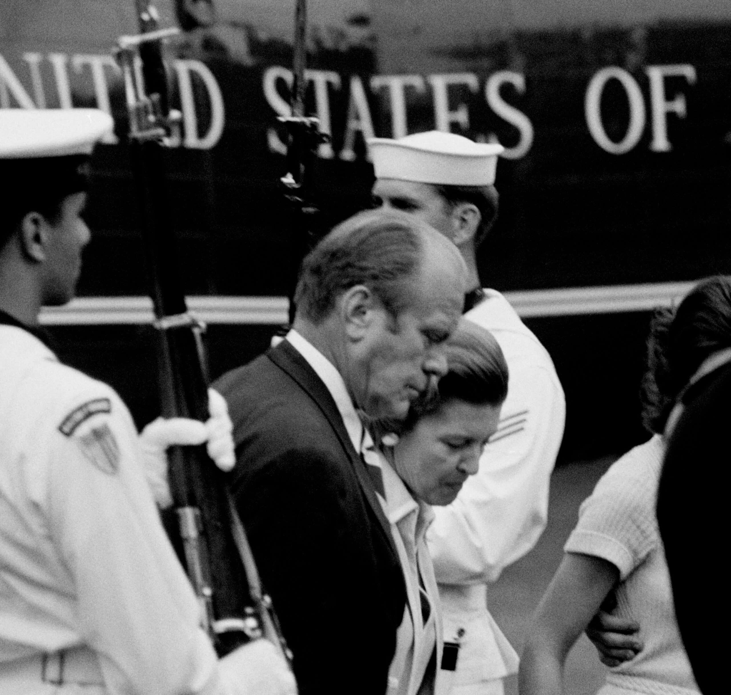 Vice President and Mrs. Ford walk away from the helicopter