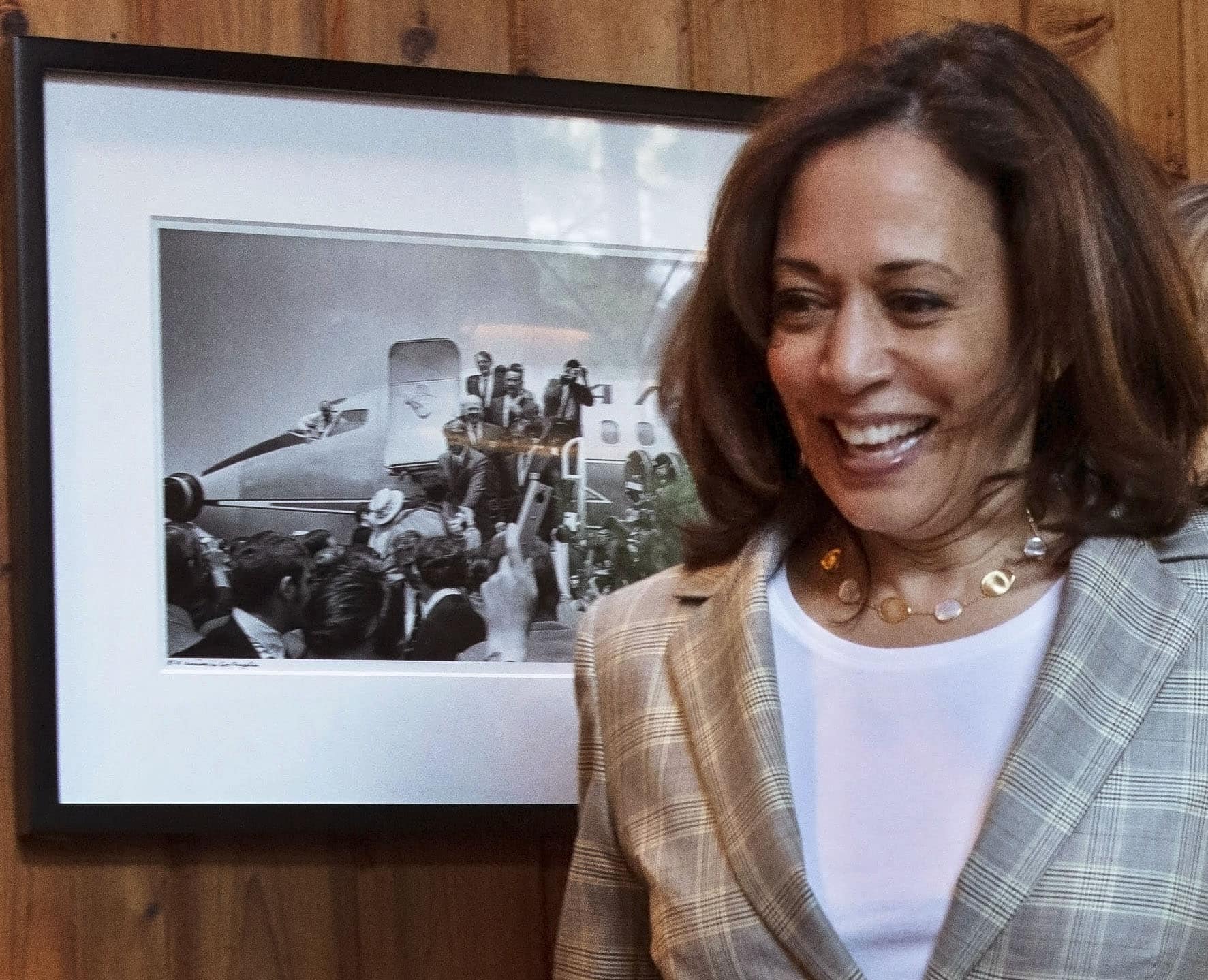 Kamala Harris walks by my picture of Sen. Robert Kennedy arriving in L.A.