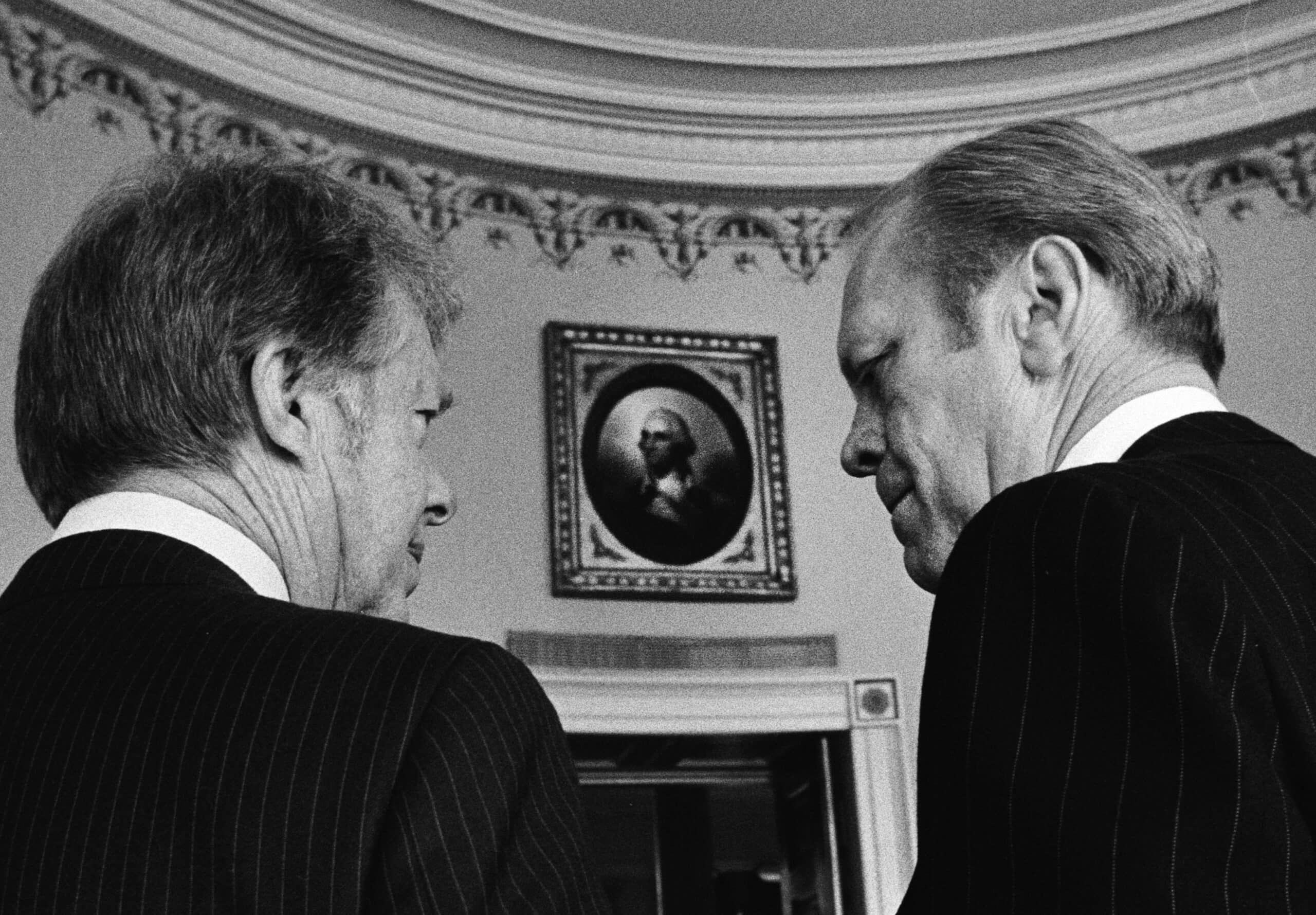 President-elect Jimmy Carter and President Ford in Blue Room of White House with George Washington portrait